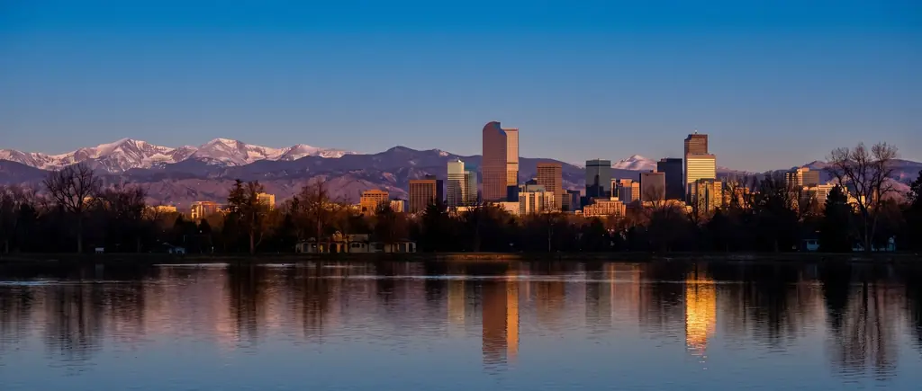 Denver skyline from City Park with the snow-capped Front Range behind